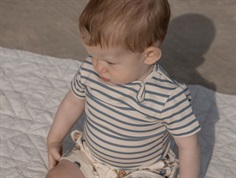 Petit Piao bodysuit with blue mirage stripes  